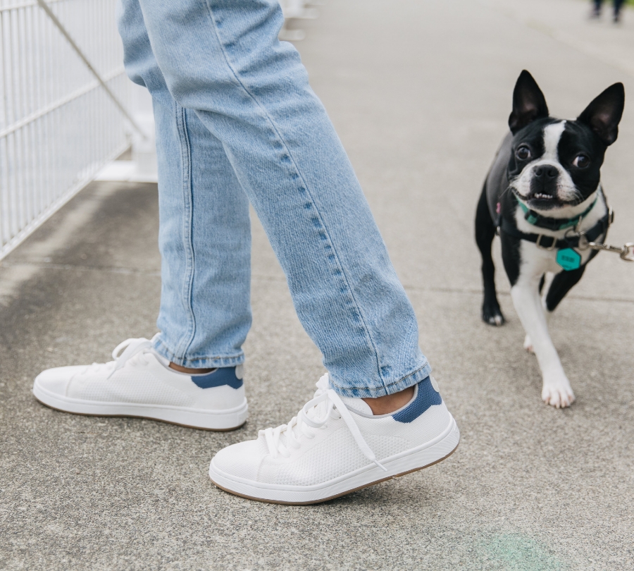 Dog And A Woman Wearing Women's The Classic Sneakers