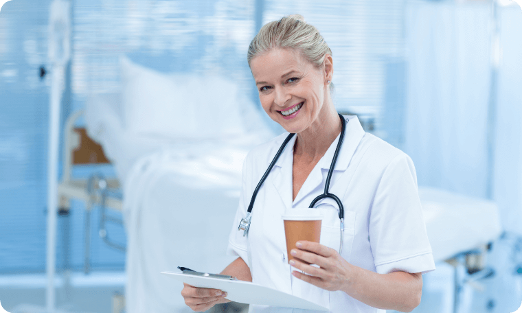 Smiling Doctor Holding Coffee