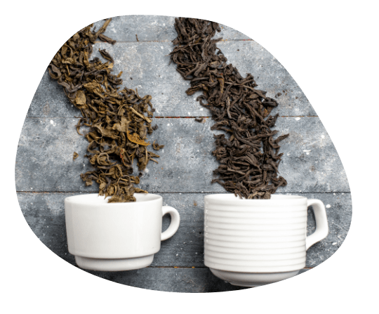 Two Cups Spilling Cut Tea Leaves