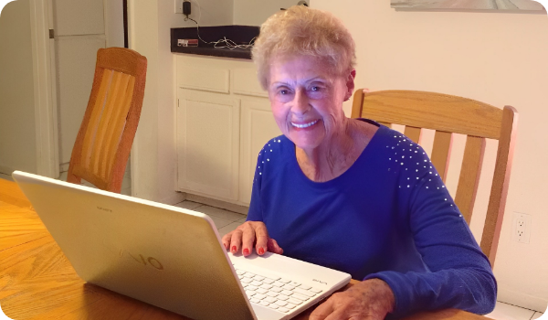 An Elderly Woman Using a Laptop