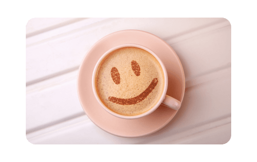 White porcelain cup and coffee grains