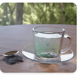 Tea Cup With Water and Microplastics