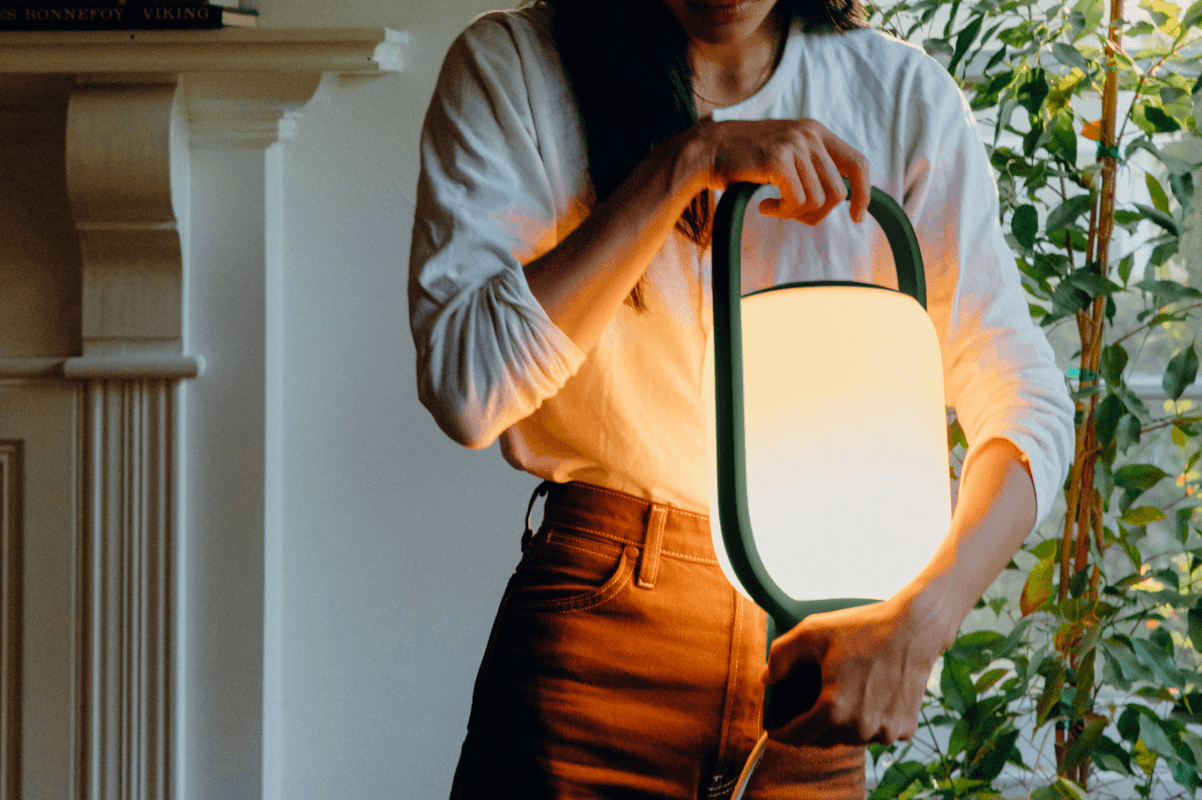 Woman Holding a Kero Table Light